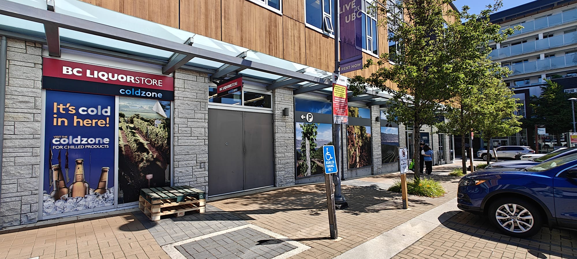 Exterior storefront signage and window graphics at BC Liquor Wesbrook