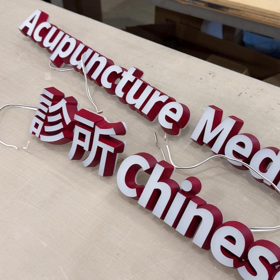 Fabricated bilingual channel letters in English and Chinese for KPU Traditional Chinese Medicine Clinic signage.