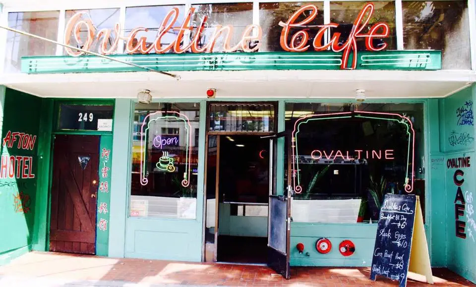 Front entrance of Vancouver's historic Ovaltine Cafe with neon signage, vintage storefront design, and classic diner atmosphere