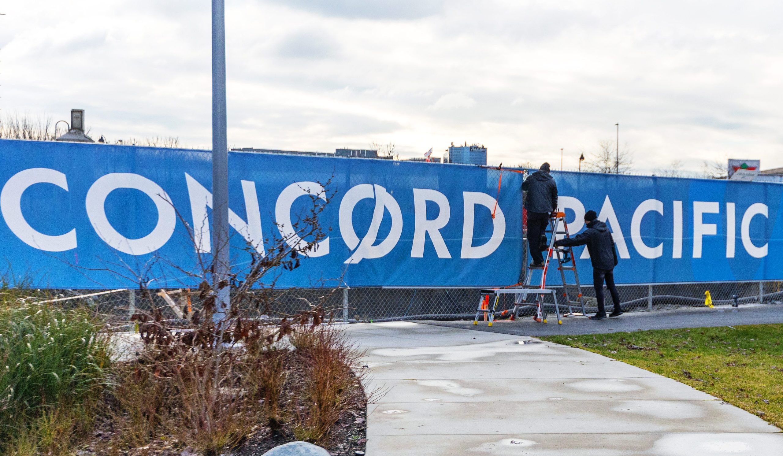 fence banner installation for Concord Pacific