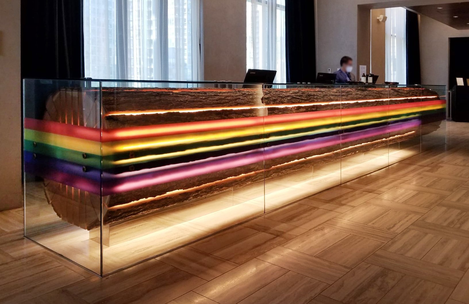 Contour-cut decals and a wrapped reception desk installed by Can-Design at Parq Vancouver